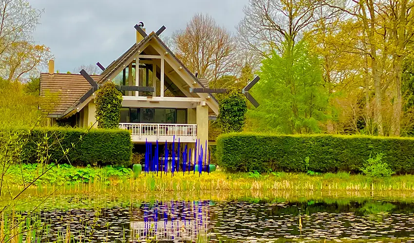 photo of exterior with pond in foreground
